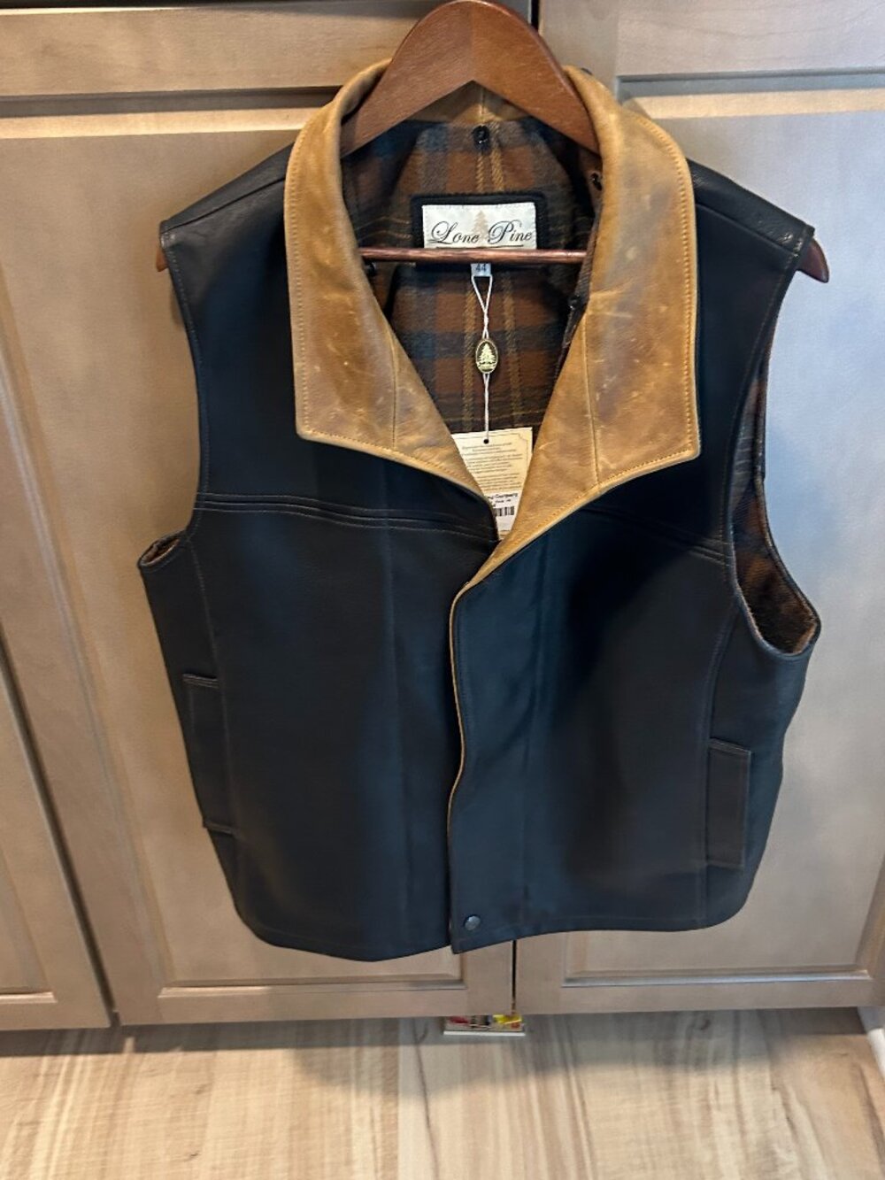 LONE PINE, MOUNTAIN HIGH LEATHER VEST, BLACK WITH BROWN TRIM AND PLAID LINING